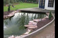 Tuinhuis met vlonder bij vijver