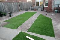 Tuinaanleg met bestrating en kunstgras