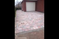 Oprit van getrommelde klinkers