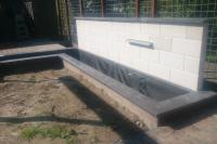 Maken van strakke vijver met watermuur
