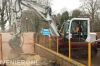 Boomstronk verwijderen met frees aan graafmachine