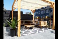 Terras met pergola en harmonicadoek