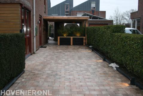 Oprit bestrating en carport