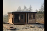 Houten tuinhuis met veranda