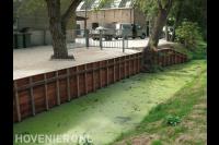 Oude damwand vervangen door nieuwe houten beschoeiing