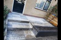 Onderhoudsvriendelijke voortuin met bestrating en plantenbak