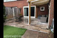 Terras bestraten en kunstgras leggen