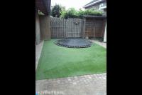 Grasmat met ingebouwde trampoline