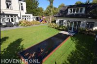 Tuinaanleg met terras, gazon en vijver