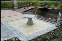 Aanleg nieuwe terras en zithoek met kunst