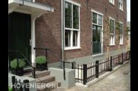 Voortuin aanleggen met sierhekwerk en leibomen