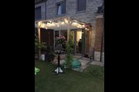 Pergola met harmonicadoek en verlichting