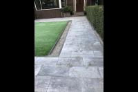 Bestrating van natuursteen tegels