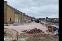 Bestraten van openbare weg in nieuwbouwwijk 1