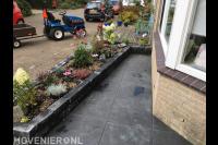 Voortuin aanleggen met bestrating en verhoogde border