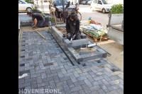 Voortuin bestraten en plantenbakken maken