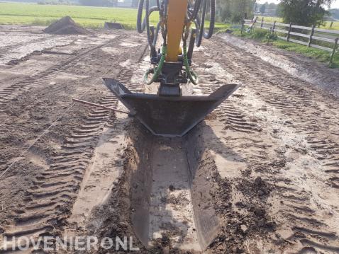 Sleuf graven voor drainage