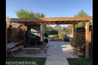 Aanleg van een complete tuin met een sfeervolle overkapping