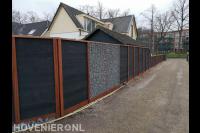 Houten schutting met schanskorf panelen