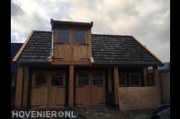 Grote maatwerk houten schuur met pannendak en  dakkapel