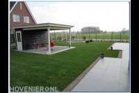 Aanleg volledige tuin met gazon, terras en overkapping met berging