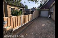 Schutting met hoogteverschil langs oprit