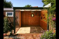 Terras met pergola met harmonicadoek