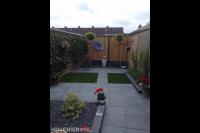 Onderhoudsarme achtertuin met bestrating en kunstgras