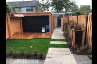 Houten pergola met harmonicadoek en vlonder