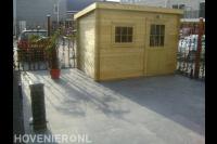 Tuinaanleg met bestrating, verlichting, hedera schutting en schuurtje