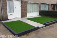 Onderhoudsvriendelijke voortuin met sierbestrating en kunstgras