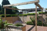 Houten pergola met harmonicadoek