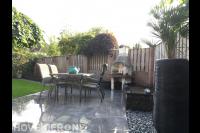 Terras aanleggen met natuursteen tegels