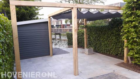 Houten pergola met harmonicadoek