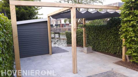 Houten pergola met harmonicadoek