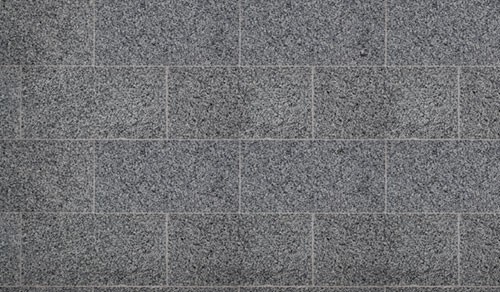 Granieten tegels in halfsteenverband